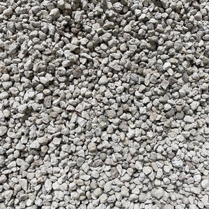 May include: A close-up view of a pile of small, white, and gray gravel. The gravel is a mix of different sizes and shapes, and it has a rough, textured surface.