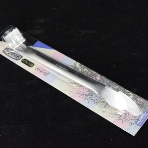 May include: A silver metal spatula with a rounded tip, packaged on a white and pink background with Japanese text. The text reads "Kichi-ri" and "Yagatsu" in Japanese.