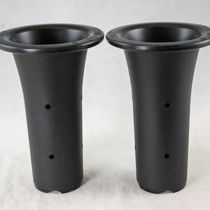 May include: Two black plastic flower vases with a flared shape and a wide, flat rim. Each vase has three small holes and a slightly textured surface. The vases are designed to hold flowers and are suitable for various floral arrangements.