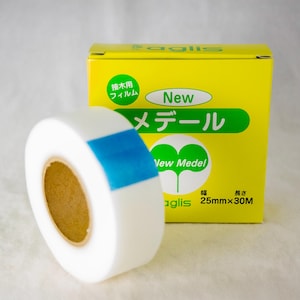 May include: A roll of white grafting tape with a blue stripe on the side. The tape is labeled "New Medel" and is 25mm wide and 30m long.