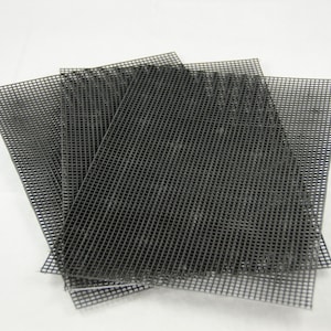 May include: A stack of four rectangular black plastic mesh sheets. The sheets are made of a grid of small, square openings. The mesh is a dark gray color and appears to be new.