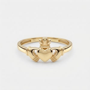 May include: A set of three ceramic mugs with a speckled, matte finish in cream, light grey, and dark grey. Each mug has a simple, minimalist design and a rounded handle.