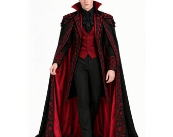 May include: A floor-length black cape with a red satin lining and intricate red floral embroidery along the edges. The outfit includes a deep red vest, a black shirt with a ruffled collar, and black trousers, creating a formal layered ensemble.