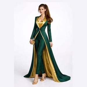 May include: A dark green jumpsuit featuring a long, floor-length overcoat with a gold satin lining and lapels. The ensemble includes a fitted bodice with a sweetheart neckline, long sleeves, and slim-fit trousers, accented by a single gold button.