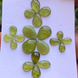 Gorgeous rare fine quality peridot cabochons pear shape wholesale lot weight 27 carats size 6.9x5-13x10mm pieces 20 peridot cabochons