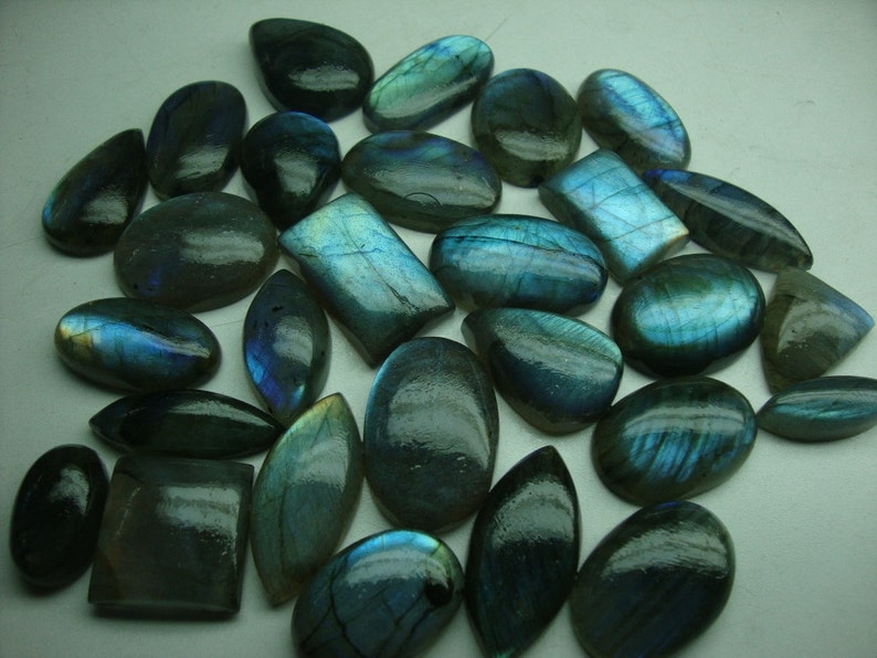 Labradorite Blue Cabochons Very Rare flashy blue fire Wt 587 cts Pcs 28 huge size Wholesale price Good Sizes Mix shapes Ovals Pears