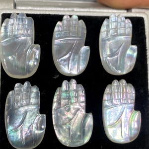 Rare High quality mother of pearl and crystal doublet hamsa hand carving mop pcs   6 wt 56 carats size 19x11mm fire pearl intricate carving