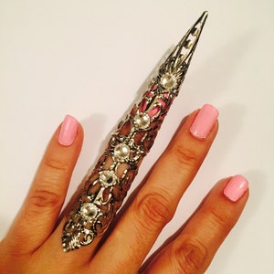 Spike nail guard,shield ring, armor ring or claw ring made in dull silver color filigree and adorned with clear crystals, is sizable.