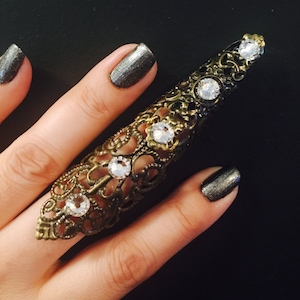 Shield Full finger ring, armor ring, made with a vintage style filigree,Brass color metal, decorated with clear crystals.