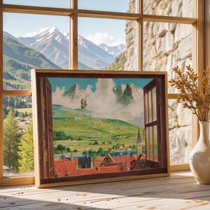 May include: A framed artwork depicting a landscape scene with a ship in the sky, set against a backdrop of mountains and a town with red rooftops. The artwork is displayed on a wooden surface near a window.