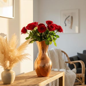 May include: A trio of cream-glazed ceramic mugs, each adorned with a hand-painted floral pattern in blue, green, and yellow. The mugs have a speckled finish and a classic, rounded design with a handle. Ideal for tea or coffee.