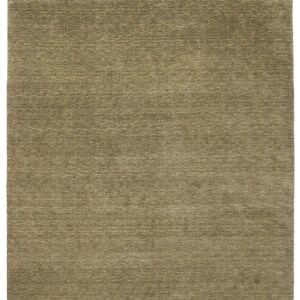 May include: A rectangular area rug featuring a solid, muted olive green color with a subtle, horizontal, linear texture throughout the surface. The rug has a consistent, dense pile appearance with slight variations in tone across the fabric.