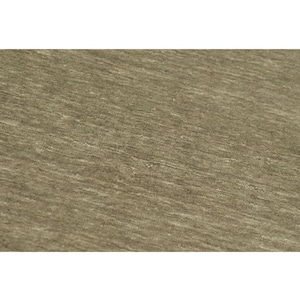 May include: A close-up view of a fabric surface featuring a heathered, taupe-colored textile. The material displays a subtle, horizontal grain with variations in tone, creating a soft, textured appearance across the entire visible area of the cloth.