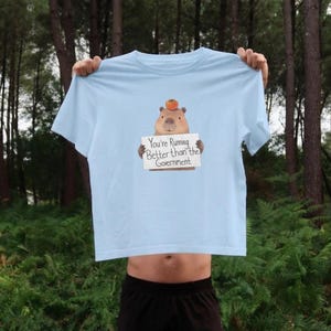 Funny capybara meme running shirt sarcastic quote graphic tee marathon runner gift cute animal workout t-shirt better than government