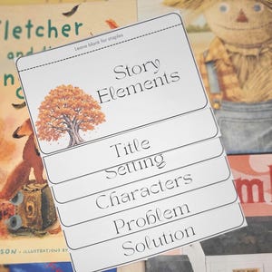May include: A white paper flip-book organizer with the heading Story Elements and an illustration of an orange autumn tree. The pages are labeled Title, Setting, Characters, Problem, and Solution in black text, with a space at the top for staples.