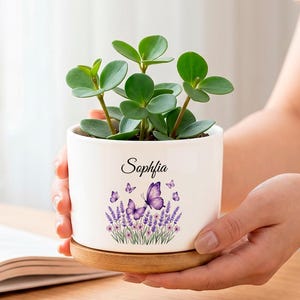 Personalized butterfly-patterned ceramic flower pots, customizable with namesgifts for flower and plant lovers,  and garden decorations.