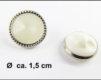 May include: Two white buttons with a silver metal rim and a rope-like design. The buttons are approximately 1.5 inches in diameter.