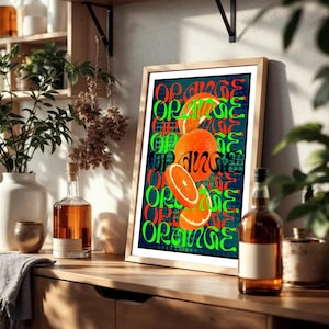 May include: A framed art print with a bold orange theme. The artwork displays realistic oranges and slices, with the word "ORANGE" in green and black. The print is set against a dark teal background, with a wooden frame.