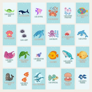 May include: A collection of 24 illustrated cards with sea creatures and inspirational phrases. Each card features a different marine animal, such as a turtle, whale, or fish, with a positive affirmation like "I am blessed" or "I am loved."