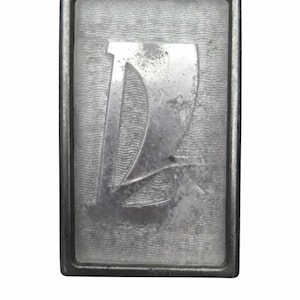 May include: A set of three ceramic mugs with a speckled, matte finish. The mugs are in shades of cream, light gray, and dark gray. Each mug has a simple, minimalist design, perfect for coffee or tea.