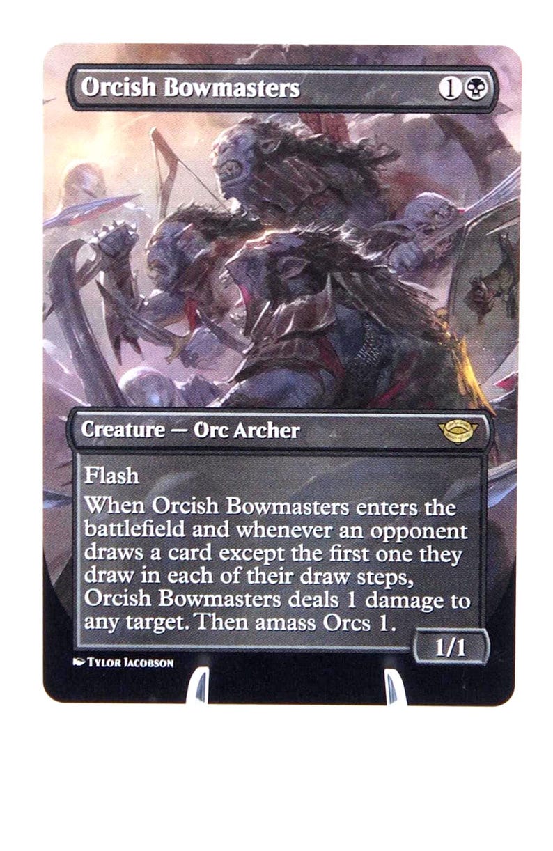 Peut inclure: Carte Magic: The Gathering "Orcish Bowmasters" avec une illustration d'Orcs au combat. Le texte de la carte inclut "Cr&eacute;ature - Archer Orc" et des instructions de jeu. La carte a une force/endurance de 1/1.