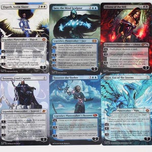 May include: A collection of ten Magic: The Gathering trading cards arranged in two rows. The cards feature various legendary planeswalker characters including Ajani, Elspeth, Jace, Liliana, Oko, Teferi, Tezzeret, Ugin, and Wrenn and Six with text.