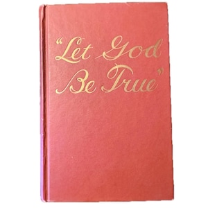 May include: A rectangular hardcover book with a solid red cover. The front cover features the text "Let God Be True" embossed in a metallic gold script font, centered in the upper portion of the book's front surface.