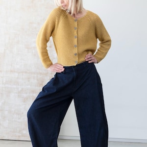 Mustard cardigan outfit with wide leg pants, modern minimalist look