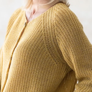 Mustard knit cardigan close-up, breathable wool blend texture