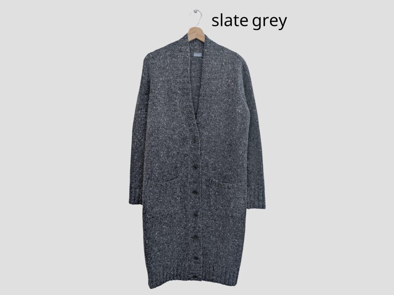 Slate grey Donegal tweed wool cardigan laid flat, front button closure and pockets