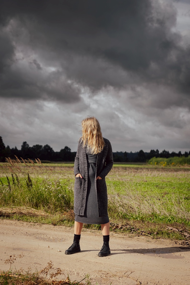 Luxury handmade Donegal wool cardigan in natural outdoor landscape, heritage winter knitwear