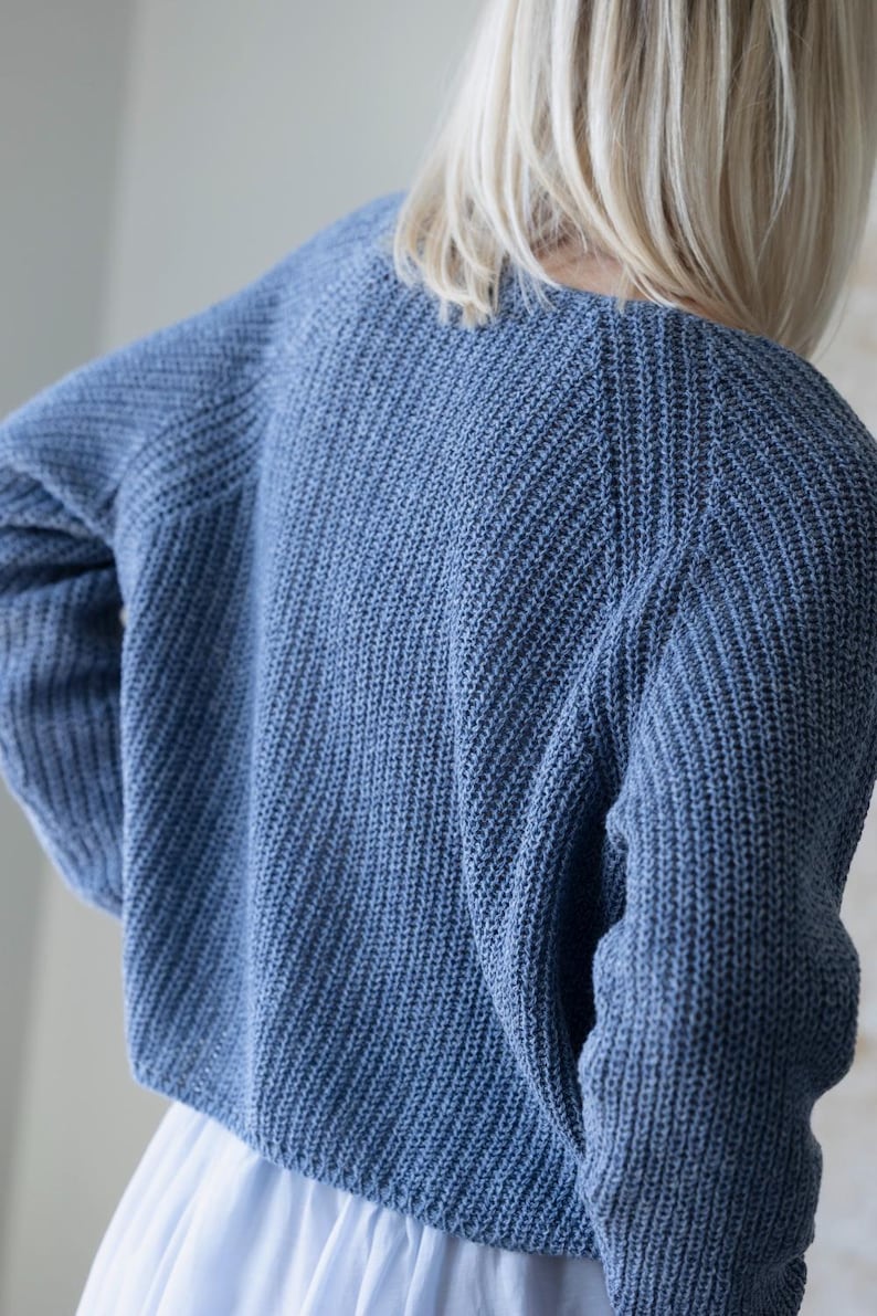 Back view blue knit cardigan, relaxed oversized fit sweater