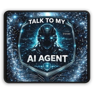 May include: Black rectangular mouse mat with a futuristic design. The centre features a robotic figure with glowing blue eyes and the text "TALK TO MY AI AGENT". The background is a starry, cosmic pattern.