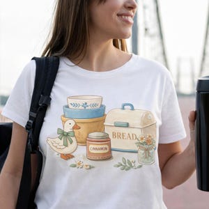 May include: A handmade wooden sign with the text "Welcome" in a handwritten style. The sign is painted white with a distressed finish and features a small, decorative heart. Measures approximately 12 inches wide.