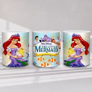 May include: White ceramic mug featuring Ariel from Disney's The Little Mermaid. The design includes Ariel with red hair and a purple dress, holding a shell. The center mug displays the movie title and characters.