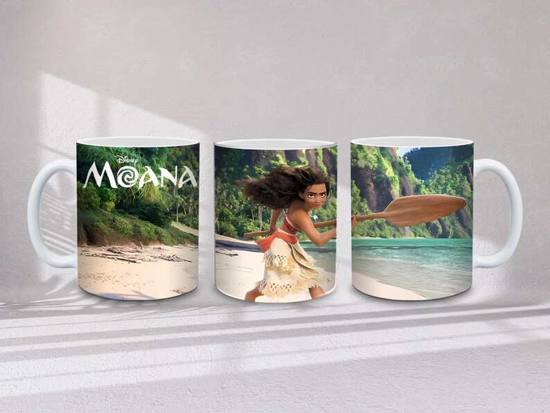 May include: White ceramic mugs with images from the Disney film Moana. One mug shows the film's title, and the others depict Moana on a beach with a paddle and tropical scenery. Each mug has a white handle.