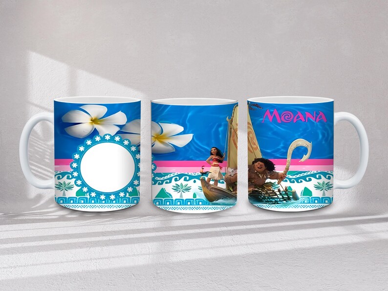 May include: White ceramic mug featuring designs from the animated film Moana. The mug has a blue background with images of the characters, the word "Moana", and tropical flowers. The mug has a white handle.