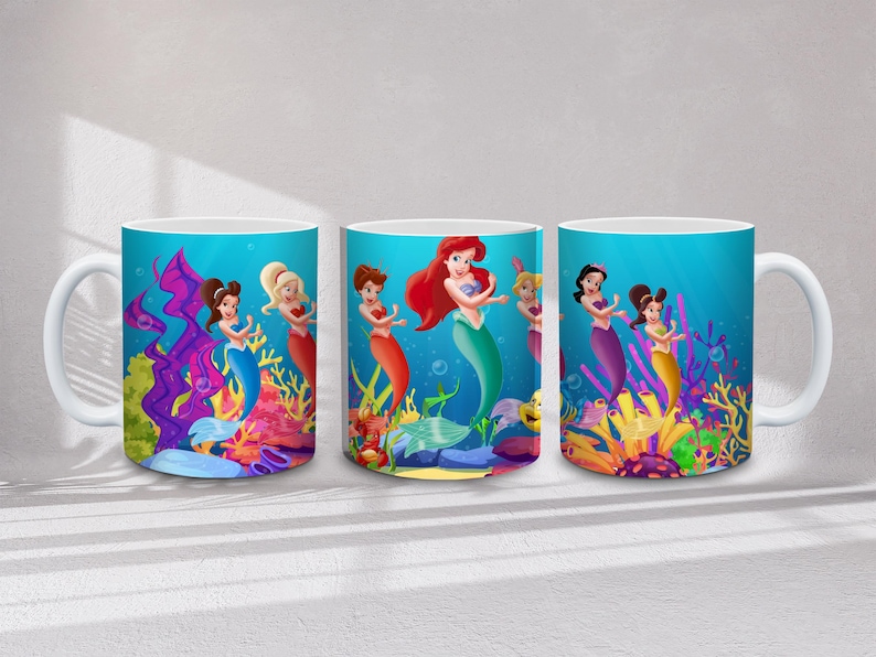 May include: Three white ceramic mugs with wraparound mermaid designs. Each mug features a different mermaid with red, blonde, and brown hair, set against a vibrant underwater scene with colorful coral and fish.