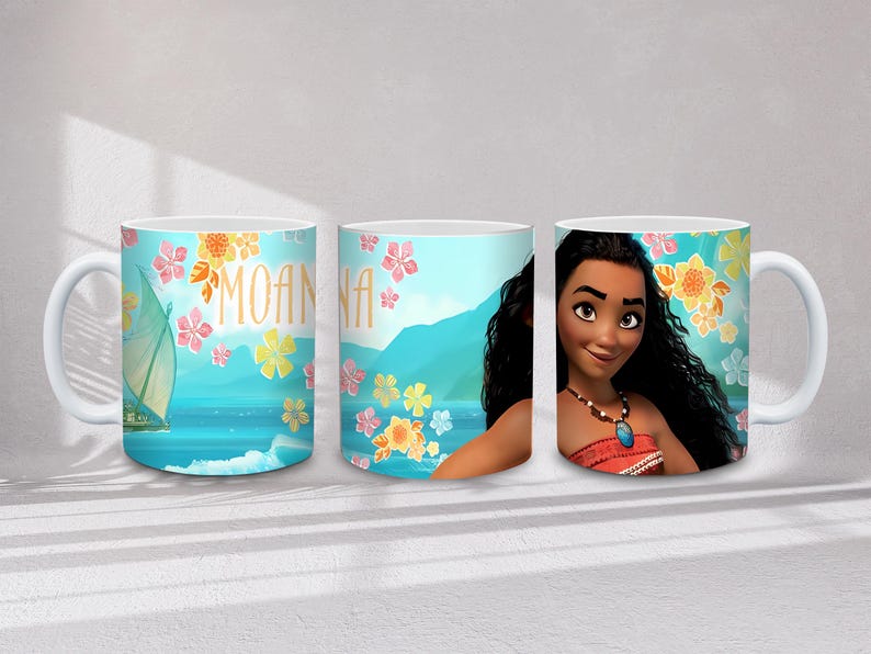 May include: White ceramic mug featuring the character Moana. The mug has a light blue background with floral and ocean-themed illustrations. The word "MOANA" is written in gold letters.