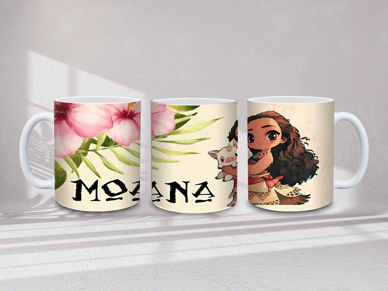 May include: White ceramic mug with the word "MOANA" in black, alongside pink hibiscus flowers and green leaves. The mug also features a cartoon illustration of Moana and a pig.