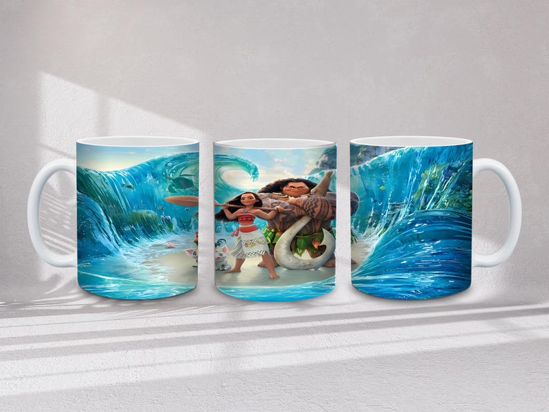May include: White ceramic mug with a colourful illustration of characters from the animated film Moana. The design features Moana, Maui, and ocean waves in blue and turquoise hues. The mug has a white handle and a glossy finish.