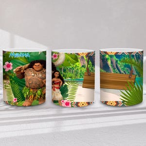May include: White ceramic mug with images from the film "Moana." The mug displays Maui, Moana, and tropical scenes with bright colours and patterns. The word "Moana" is visible on the mug.