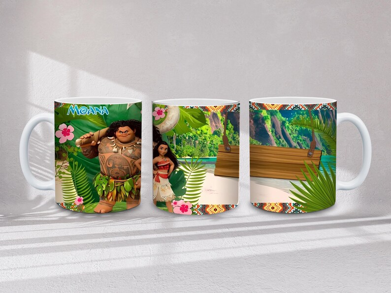 May include: White ceramic mug with images from the film "Moana." The mug displays Maui, Moana, and tropical scenes with bright colours and patterns. The word "Moana" is visible on the mug.