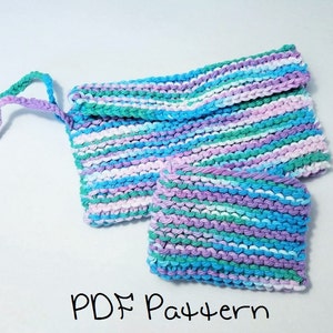 May include: A knitted clutch and matching square pouch in shades of blue, green, purple, and white. The clutch has a flap closure and a small handle. The text "PDF Pattern" is written at the bottom.
