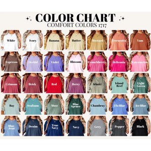 May include: Color chart of Comfort Colors 1717 t-shirts. The chart displays a variety of colors, including white, ivory, banana, butter, mustard, terracotta, yam, espresso, orchid, violet, blossom, crunchberry, helliconia, watermelon, crimson, brick, red, berry, khaki, island reef, light green, bay, seafoam, moss, blue spruce, chambray, flo blue, ice blue, blue jean, denim, true navy, navy, grey, pepper, and black.