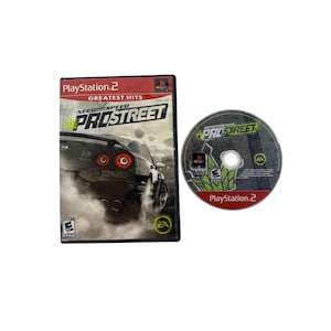 May include: A PlayStation 2 video game case and disc for Need for Speed ProStreet. The case is black with a car graphic and the game title. The disc has the game title and PlayStation 2 logo.