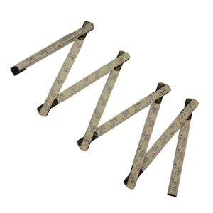 May include: A vintage off-white folding wooden ruler with dark metal hinges and black printed numerical scales. The tool features the text 'The Lufkin Rule Co.' and 'Doyle Log Scale' printed along its segments, showing imperial measurement markings.