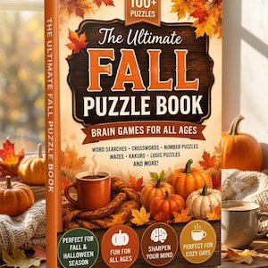 Op de afbeelding: Een paperback getiteld The Ultimate Fall Puzzle Book met een donker houten bord, oranje tekst en herfstbladeren. De kaft toont pompoenen, een dampende mok en somt puzzeltypes op zoals woordzoekers en kruiswoordraadsels.