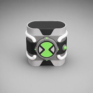 May include: A wrist-worn device featuring a black and gray rectangular base with rounded edges. A circular central dial displays a bright green hourglass-shaped symbol. The design includes white curved accents and small green circular buttons.