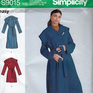 May include: A set of three ceramic mugs with a speckled, cream-colored glaze. Each mug features a different hand-painted design: a sun, a moon, and a star. The mugs have a minimalist, modern aesthetic.